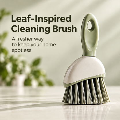 Full view of the sage green hand brush and shaped short handle