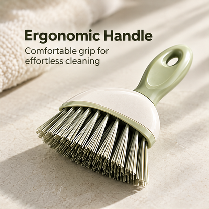 Close-up of the curved handle and flared bristle edge