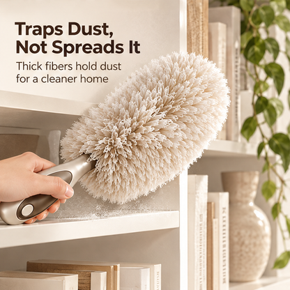 Hand holding the contoured grip of the cream duster