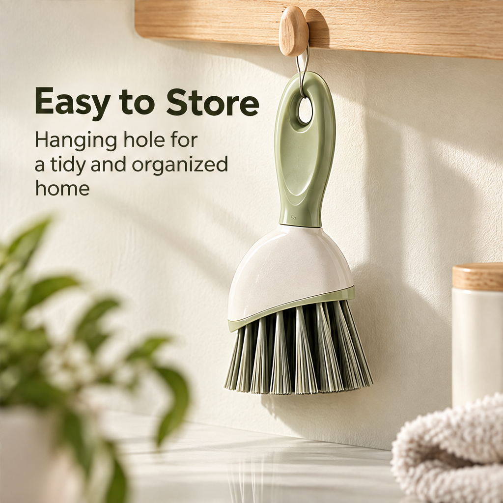 Sage green hand brush used with suds beside a sink